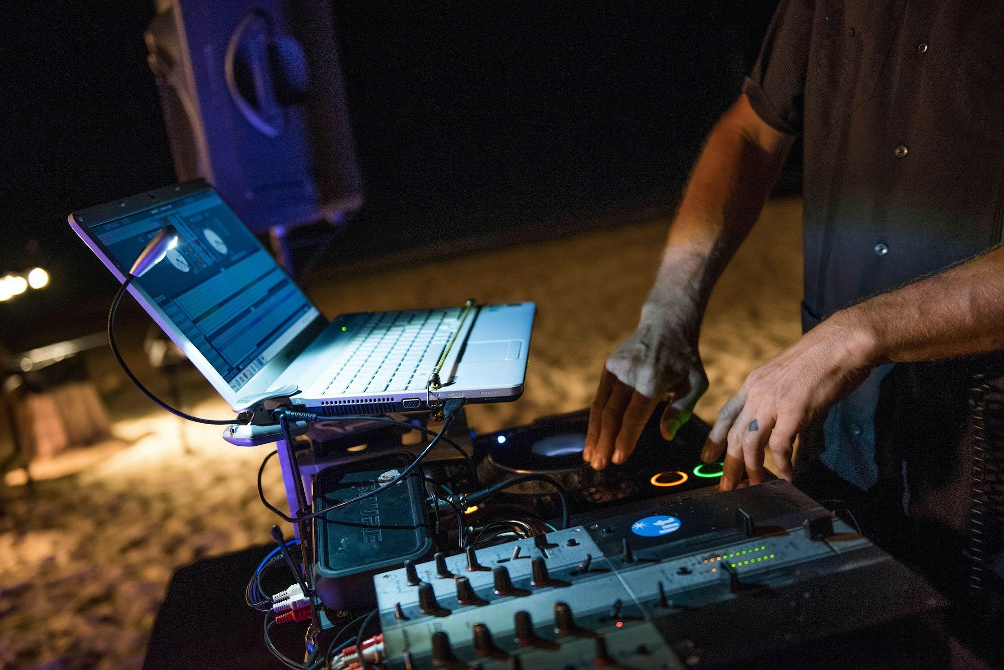 Dj spinning cayman event