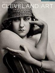 photograph in black and white of Gloria Swanson in bare arms wearing a fashionable hat with a pattern and a striped swimsuit by Nikolas Muray on the magazine cover
